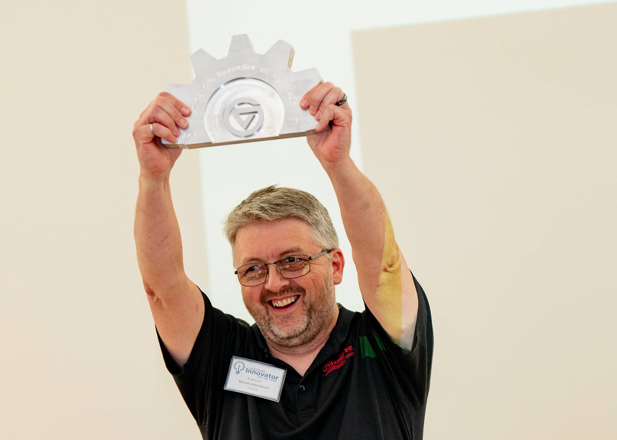 Michael Gerstweiler holding an award